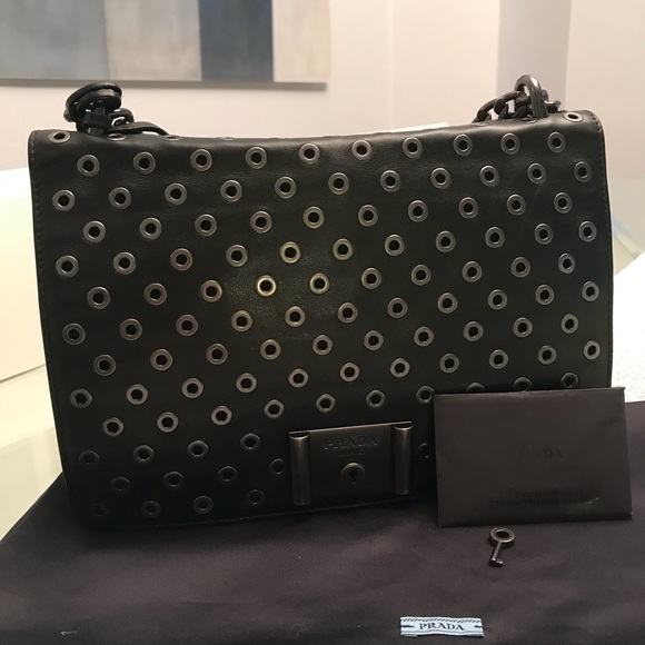 prada grommet bag